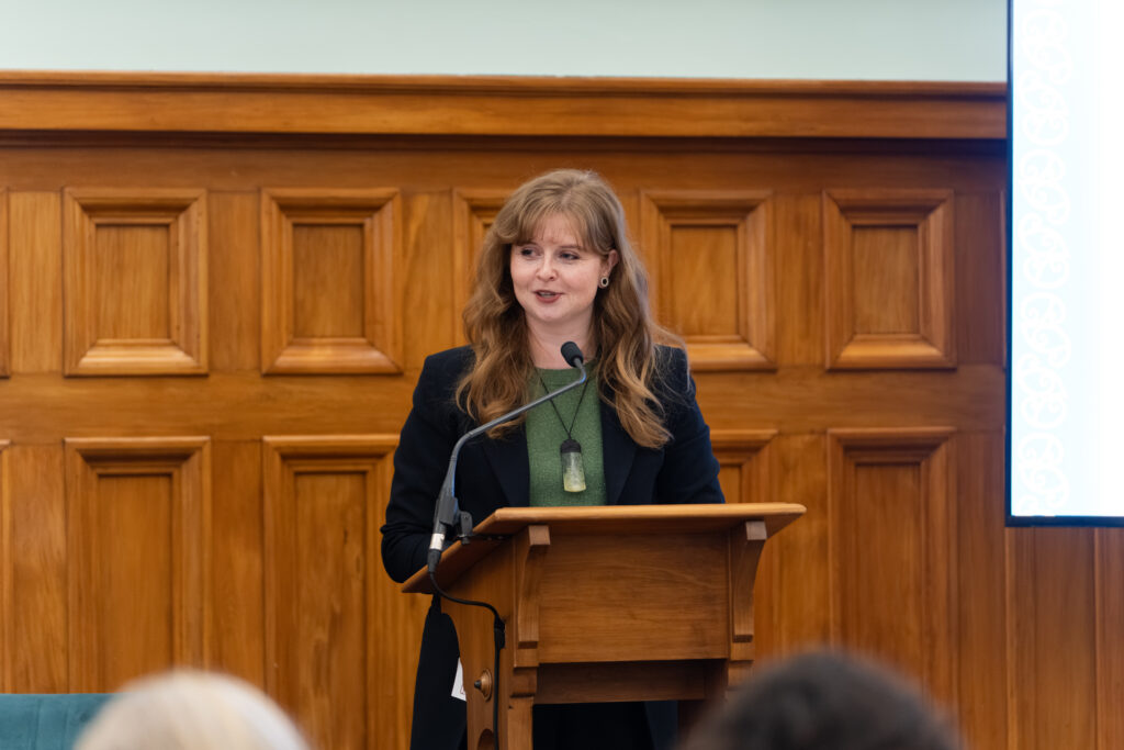 NZCCSS Chief Executive Alicia Sudden speaking at a lectern.